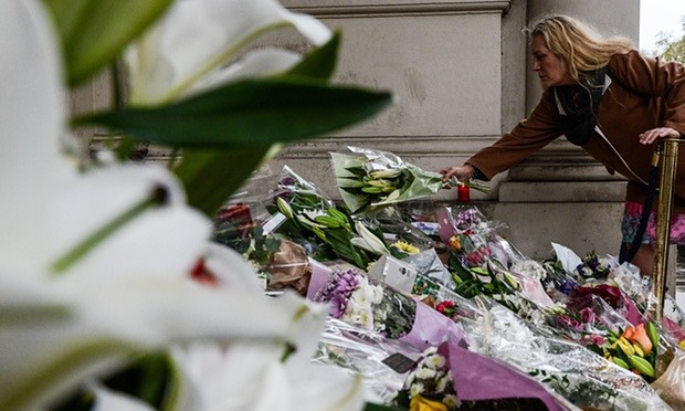 Pic 1. Members of the public lay flowers on the steps of the French embassy in London. Photograph, Chris Ratcliffe/Getty Images