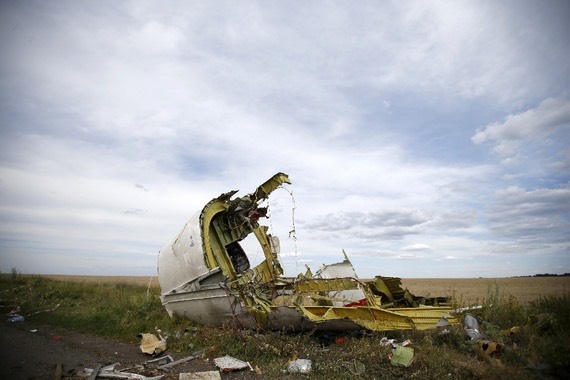 Pic 1. Part of the wreckage from Malaysia Airlines Flight MH17, in the Donetsk region of Ukraine (Maxim Zmeyev_Reuters), lead