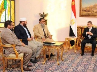 Pic 3. Morsi celebrated 6 Oct , the day of President Sadat assassination, Morsi with late president Sadat’s assassins in Etihadeya presidential palace